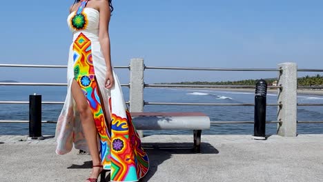 Young-woman-models-open-dress-with-hand-drawn-Huichol-art-decorations