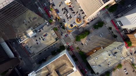 A-descending-aerial-shot-of-a-4-way-intersection,-located-downtown