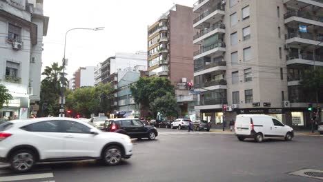 Car-traffic-at-directorio-avenue-fast-asphalted-lane-in-south-american-city-metropolitan-area-at-sunset