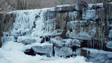 Snow-Covered-Stone-Barrier-In-The-Unused-Old-Dam