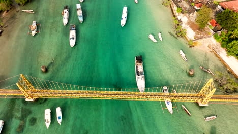 Bali-Yellow-Bridge-connecting-two-islands-of-Nusa-Lembongan-and-Nusa-Ceningan,-Indonesia