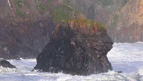 Sea-Stack-and-sea-cliffs-with-incoming-storm-waves-storm-Kathleen-on-the-Copper-Coast-Waterford-Ireland