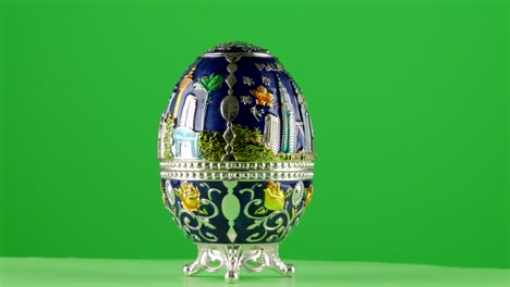 Malasya-Kuala-Lumpur-Faberge-egg-souvenir-memory-blue-petrona-twin-towers-klcc-on-green-background-chroma-key-background-replacement-backdrop-objet-in-a-turntable-3d-spinning-loop