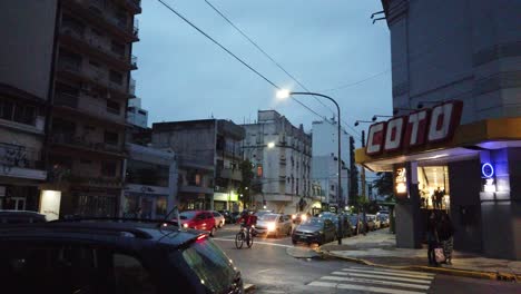 Coto-supermarket-convenience-store-at-gaona-avenue-latin-american-traffic-stores-commercial-area-at-evening-dusk-buenos-aires-city-argentina