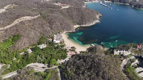 Aerial-view-of-Bahia-la-Entrega,-with-Bahia-Santa-Cruz-in-background,-Huatulco,-Oaxaca