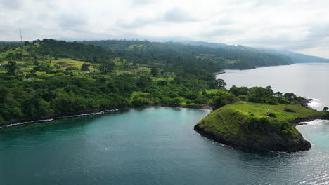 Aerial-shot-of-a-the-beacon-at-Lagoa-Azul-and-the-coastline-of-Sao-Tome,-Africa