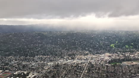 City-of-San-Francisco-on-rainy-day-from-flying-plane,-stormy-weather