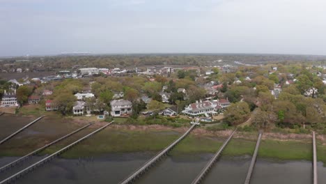 Aerial-low-shot-flying-over-fishing-docks-near-historical-Old-Village-Mount-Pleasant,-South-Carolina