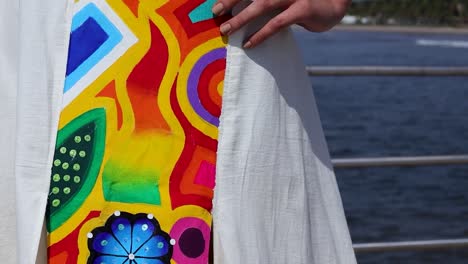 Blanket-dress-painted-with-Huichol-Art-details-in-vibrant-colors