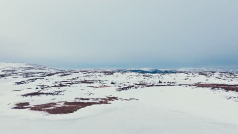 Aerial-View-Of-Snowy-Mountain-Range-During-Winter-In-Verran,-Indre-Fosen,-Norway