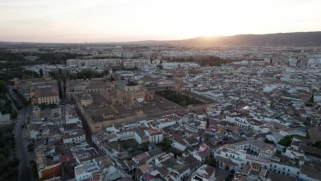 panning-aerial-view-of-mosque-cathedral-in-Cordoba,-Spain-during-blue-hour