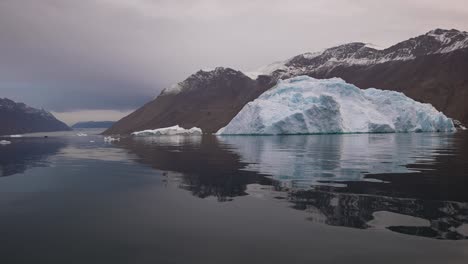 Iceberg-Floating-in-Cold-Water,-Fjord-on-Svalbard-Island-Archipelago,-Norway