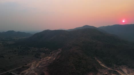 Setting-sun-over-remains-of-volcanic-creator-Krong-Kampong-Chhnang-district,-east-of-the-Tonle-Sap,-Cambodia