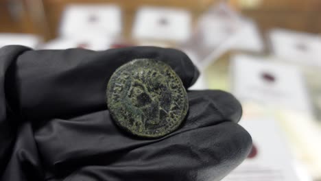 Collector-examining-Ancient-Provincial-Roman-Coin