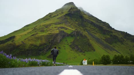 Skateboarder-does-an-epic-tre-flip-in-the-road-in-Iceland