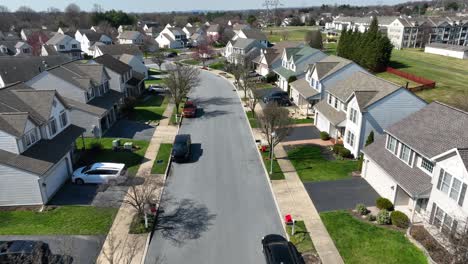 Aerial-establishing-shot-of-classic-upper-middle-class-neighborhood-street-with-luxury-single-family-homes-in-USA