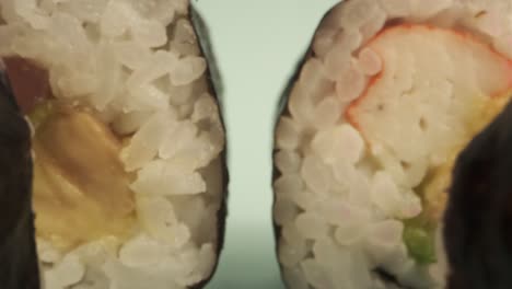 Studio-shot-of-sushi-rolls-on-blue-background