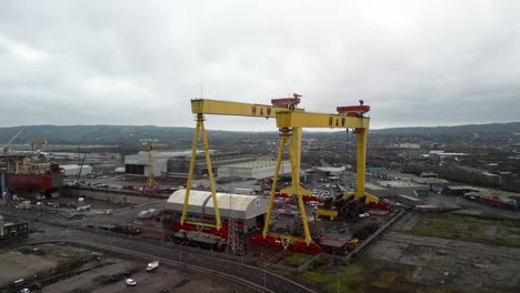 Aerial-shot-of-Harland-and-Wolff-cranes-in-Belfast-Shipyard-on-a-cloudy-day