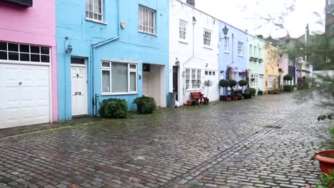 Colorful-homes-in-Conduit-Mews-on-rainy-day-in-London,-United-Kingdom