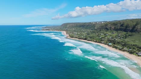 North-Shore-Oahu-As-Seen-from-Above,-Drone-Footage-of-Hale'iwa-and-Big-Waves-on-Bright-Blue-Pacific-Ocean