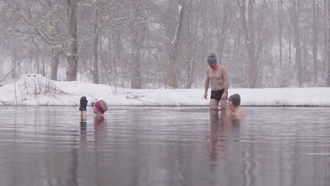 A-male-ice-bather-joins-2-women-in-an-icy-Swedish-lake