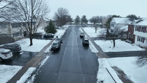 Snow-flurries-in-American-neighborhood-during-cold-winter-day