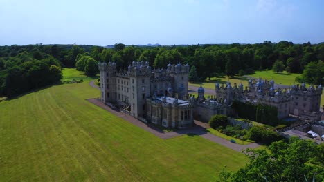 Aerial-View-of-Famous-Scottish-Castle-and-Garden-in-Scottish-Borders,-Famous-Landmark-in-Kelso,-Scotland,-United-Kingdom