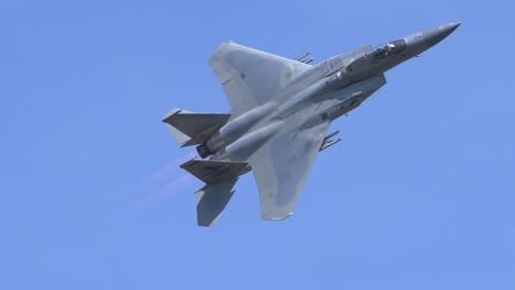 F15-Eagle-Fighter-Jet-Flying,-High-Alpha-Wing-Condensation-Trail-SLOMO