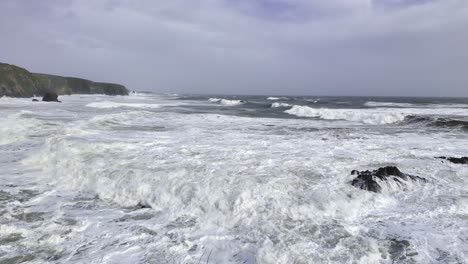 Storm-waves-crashing-against-soil-cliffs-causing-rapid-eroeion-spring-storm-Copper-Coast-Waterford-Ireland