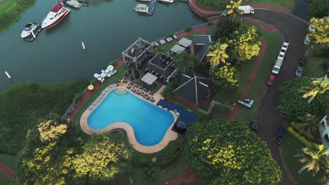 Aerial-view-of-a-hotel-pool-area-decorated-for-a-party-in-Misiones,-Argentina