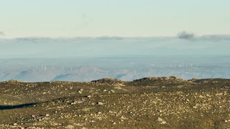 Mountain-ridge-view-of-wind-turbines-below,-Serra-da-Estrela