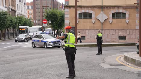 Bilbao,-Spain,-Police-Officers-on-City-Streets,-Traffic-Blockade-Regulation,-Slow-Motion