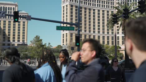 People-wait-to-cross-street-in-sunny-downtown-Las-Vegas-along-the-Strip-in-daytime