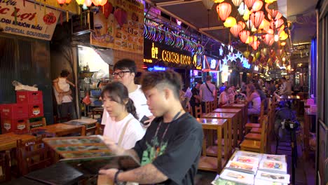 Tourists-and-staff-with-restaurant-menus