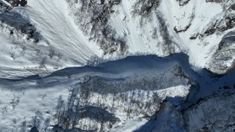 Tracking-top-down-shot-of-Japan's-mount-myōkō-valley,-massive-height-of-mountains-revealed