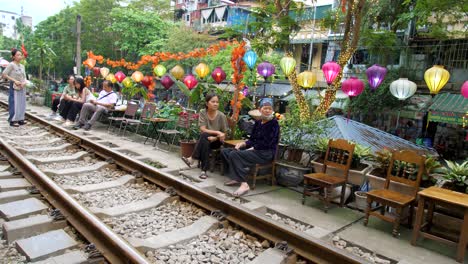 Two-elderly-Vietnamese-women-sit-down-to-chat