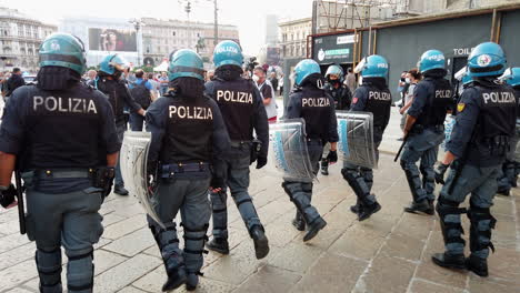 Milan,-Italy---october-2-2021--policemen-walking-in-front-of-a-at-a-rally-against-green-pass-and-forced-vaccination-against-covid-in-Italy-19