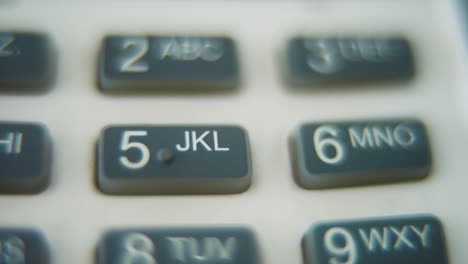 A-macro-close-up-shot-of-a-pin-pad-numbers-and-letters-on-colorful-buttons,-zoom-in-movement,-Full-HD-video,-super-slow-motion,-blurry-depth-of-field