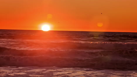 Sunset-sunrise-wonderful-nature-bright-orange-sky-sun-over-ocean-sea-water
