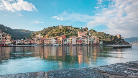 Motion-time-lapse-over-harbor-of-picturesque-sunny-Portofino-as-boat-pulls-in