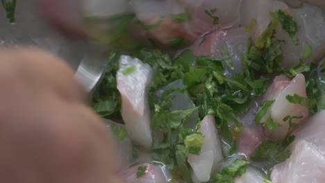 adding-coriander-and-lime-juice-to-the-fish-for-the-ceviche