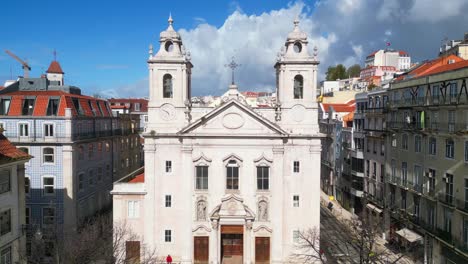 Flying-towards-the-São-Paulo-church-with-Lisbon-cityscape-as-background-at-a-sunny-day,Lisbon,Portugal