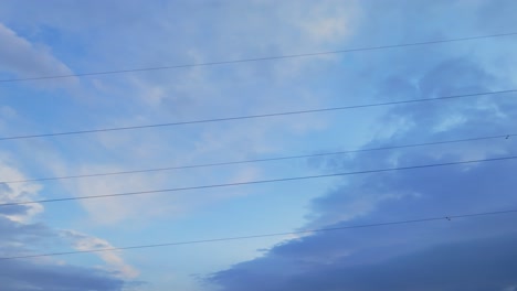Close-up-view-of-electric-wires-against-a-cloudy-sky
