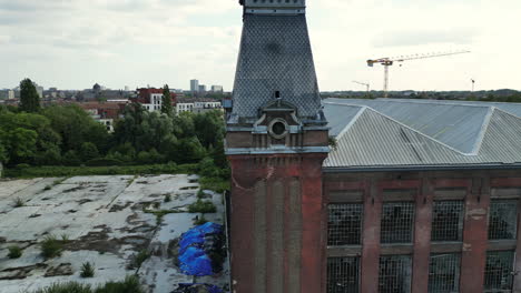 Fast-Backward-Aerial-Moving-Away-from-Tower-With-Clock-in-Ghent