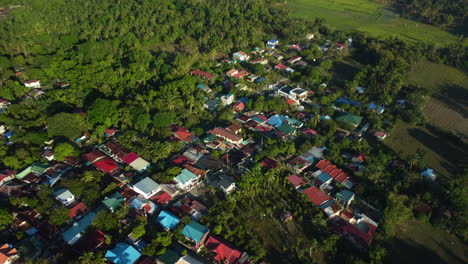 Aerial-view-around-colorful-dwellings-of-San-Pablo,-sunny-day-in-Laguna,-Philippines