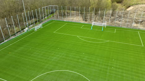 Aerial-view-of-empty-green-soccer-field-in-Poland