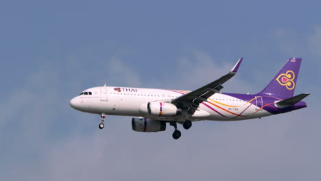 The-landing-gears-of-an-airplane-are-down-as-it-gets-ready-to-land-at-the-tarmac-of-Suvharnabhumi-airport-in-Bangkok,-Thailand