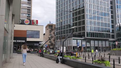 The-area-around-Starbucks-café-in-Warsaw,-Poland,-epitomizes-modern-city-life-amidst-stunning-architectural-style