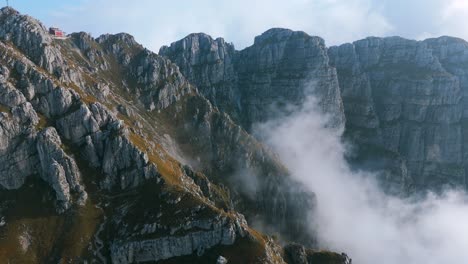 Resegone-mountain-peaks-shrouded-in-fog-on-cloudy-day-in-northern-Italy