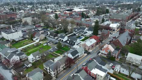 Aerial-flyover-american-town-with-historic-buildings-and-homes-in-spring-season